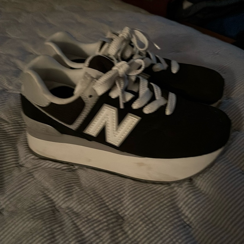 New Balance 574+ black and white tennis shoes.  Very comfortable. Stylish.